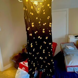 Black knee length sundress with yellow and white flowers